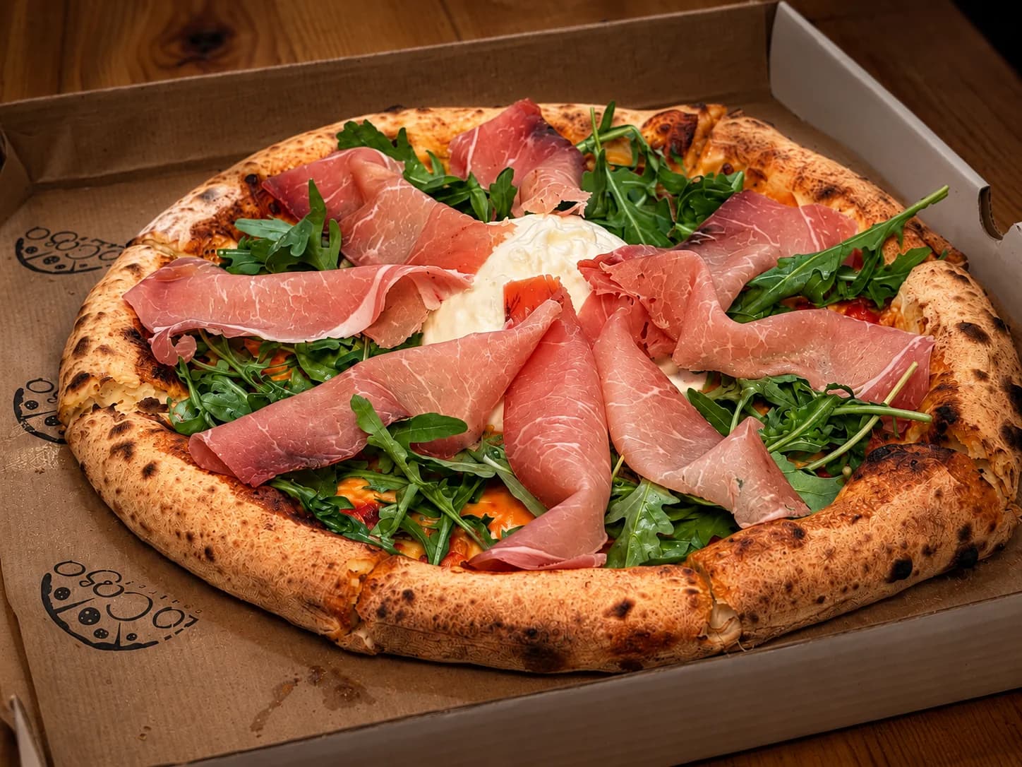Burrata pizza in a takeaway box